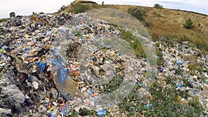 Garbage on unauthorized landfill overgrown with weeds. bird`s-eye view.