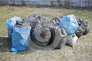 garbage and waste in black and blue bags