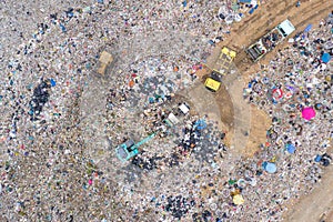 Garbage or waste Mountain or landfill, Aerial view garbage trucks unload garbage to a landfill. Plastic pollution crisis