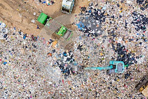 Garbage or waste Mountain or landfill, Aerial view garbage trucks unload garbage to a landfill. Plastic pollution crisis photo