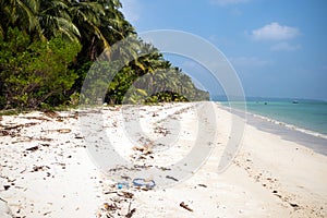 Garbage on the white sand beach of Maldives island