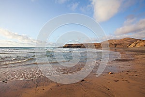 golden sand beach and rocky escarpments photo