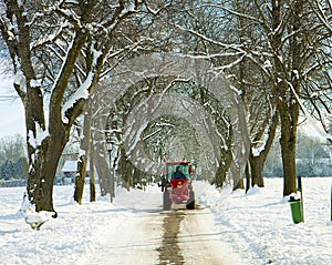 Garching, Germany -small salt truck at work on wintertime