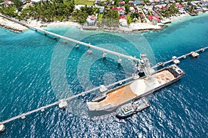 Garcia Hernandez, Bohol, Philippines - Quarried limestone is transported via a belt conveyor into a bulk carrier ship.