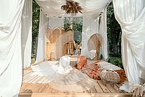 Garden arbour with rustic beige decoration, outdoor design photo