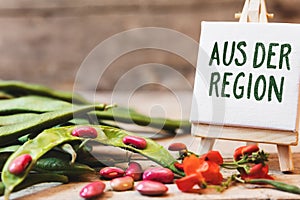 Garden beans on wooden table