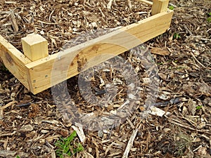 garden beds with woodchip, showing burrowing from wildlife