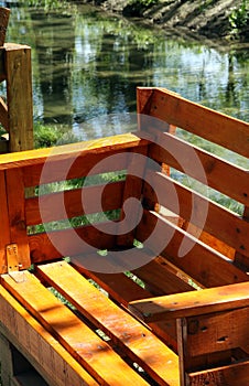 Garden bench for sitting made from old wooden pallets