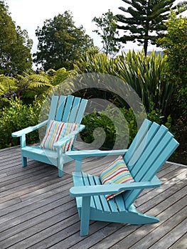 Garden: blue chairs on wooden deck