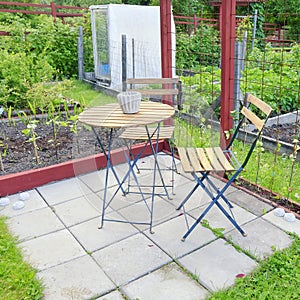 A garden center greenhouse with a colorful display of potted plants and flowers