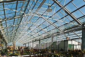 garden centre with a glass roof under a blue sky