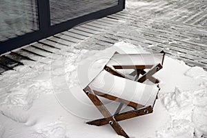 Garden chairs under snow