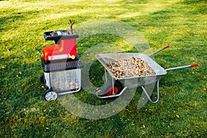 Garden chipper, electric shredder mulcher with wheelbarrow full of wooden mulch