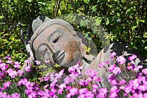Garden decoration with a lying buddha.