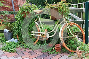 Garden decoration with a old bike.