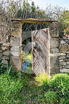 garden door and stone wall