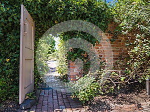 Garden doorway with brick path photo