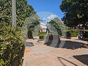 Garden Estate with Glorieta Curro Romero Statue in Seville, Spain photo