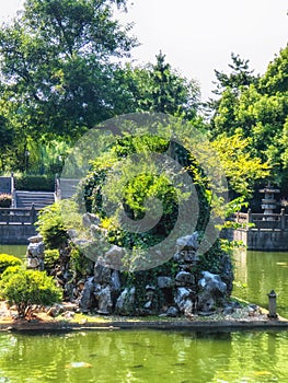 A garden with fish pool, stone bridge and pavilions, Hangzhou, China