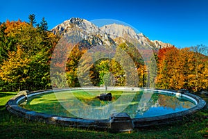 Garden with fountain in Busteni, Prahova valley, Romania, Europe