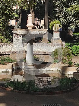 Garden with fountain of marble in malaga park