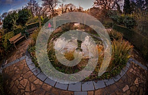 Garden fountain at sunset