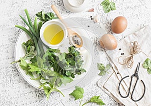 Garden herbs, spices and eggs rustic kitchen still life.On a light table, top view. Flat lay.