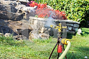 Garden irrigation system watering lawn. Watering sprayer