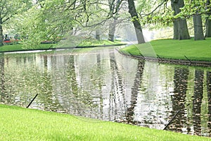 Garden landscape with waterways and tree reflections