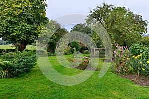 Garden with a Lawn, Flowers and Trees