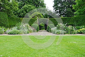 Garden Lawn, Stone Path, Flower Bed and Leafy Trees