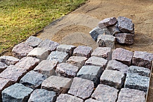 Garden path construction - laying granite stone pavers