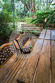 Garden patio table and bench chairs for a relaxing, peaceful outdoor dining and community backyard space