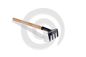 Garden rake is isolated on a white background