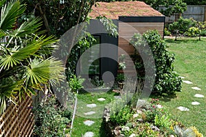 Garden room, green retreat with bee friendly, living sedum roof in well stocked, mature garden.
