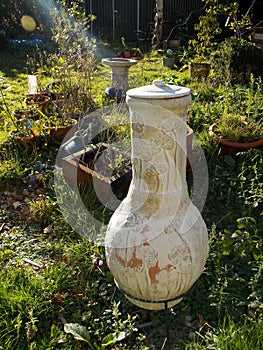 Garden scene in autumn sunlight with chiminea