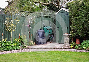 Garden Shed in an English Garden with compost bin photo