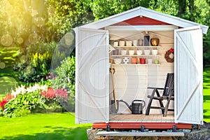 Garden shed filled with gardening tools.