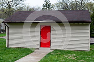 Garden shed green grass door red storage barn