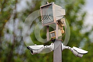 Garden spotlight with motion detectors and CCTV cameras