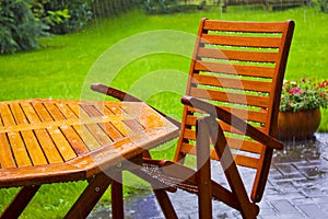 Garden table stands in the rain