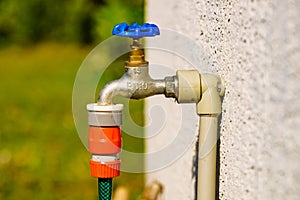 Garden tap with hosepipe attached