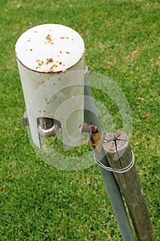 A garden tap with a metal hat