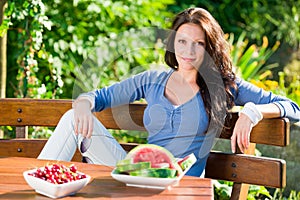 Garden terrace beautiful woman fresh summer fruit