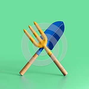 Garden tool. Blue blade and a yellow fork on green background