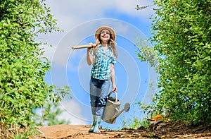 Garden tools, shovel and watering can. kid worker sunny outdoor. family bonding. spring country side village. future