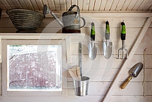 Garden tools in a small storage shed