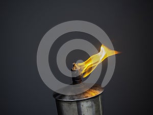 A garden torch flame on dark background