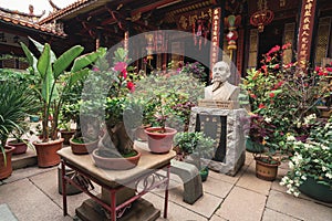 Garden in a traditional ancient architecture building in southern China, `Zhuang Family` for Chinese characters