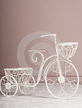 Garden white tricycle with a basket